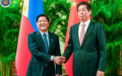 <p>President Ferdinand R. Marcos Jr. shakes hands with China’s top legislator Li Zhanshu in a meeting on Wednesday (Jan. 4, 2023), the second day of the Chief Executive's three-day state visit to Beijing. <em>(Photo courtesy of OP) </em></p>