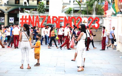 <p><strong>FAITH IN ACTION.</strong> Devotees of the Black Nazarene gather outside the Quiapo Church on Friday (Jan. 6, 2023). For the third straight year, there would be no "traslacion" or the traditional procession of the Black Nazarene's image but other activities would be held starting this weekend until the feast day on Jan. 9. <em>(PNA photo by Jess M. Escaros Jr.)</em></p>