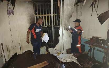 <p><strong>HOUSE FIRE</strong>. Personnel of Bacolod City Fire Station conduct an investigation following a residential fire in Barangay 16 on New Year's eve. In 2022, the city recorded 76 residential fire incidents, higher by 31 compared to only 45 incidents in 2021, data from the Bureau of Fire Protection showed.<em> (Photo courtesy of Llanee Zil Menardo)</em></p>