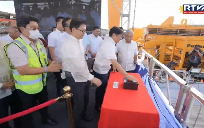 <p><strong>SUBWAY PROJECT</strong>. President Ferdinand R. Marcos Jr. pushes the ceremonial button to launch the Metro Manila Subway Project’s (MMSP) tunnel boring machine (TBM) at Barangay Ugong, Valenzuela City on Jan. 9, 2023. The Marcos administration's Build Better More Program, which includes the MMSP, will get PHP1.418 trillion under the proposed PHP 5.768-trillion 2024 National Expenditure Program (NEP) that the Department of Budget and Management (DBM) submitted to the House of Representatives on Wednesday (Aug. 2, 2023). <em>(PNA photo by Alfred Frias)</em></p>