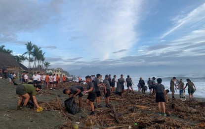 <p><strong>CLEANUP DRIVE.</strong> Some 200 individuals, including military troops, local officials and students participate in a cleanup activity along Sabang beach in Baler, Aurora on Tuesday (Jan. 10, 2023). The move aims to encourage and raise awareness of the importance of environmental sanitation and cleanliness.<em> (Photo courtesy of the Army's 91IB)</em></p>