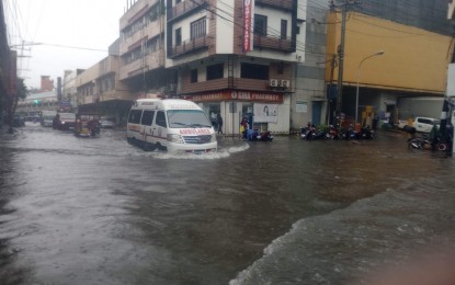 <p><strong>DOWNPOUR</strong>. A flooded major street in Tacloban City in this Jan. 9, 2023 photo. Several local government units suspended work and classes on Tuesday (Jan. 10) as heavy rains triggered floods in low-lying communities. <em>(Photo courtesy of Tacloban city engineer's office)</em></p>