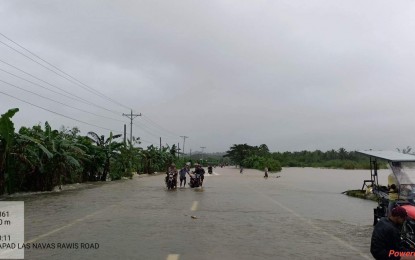 <p><strong>INUNDATED</strong>. A flooded road in Las Navas town, Northern Samar province at the highway that links several Northern Samar towns to Eastern Samar province. Flooding caused by incessant rains closed several road sections in Samar provinces on Tuesday (Jan. 10, 2023), the Department of Public Works and Highways (DPWH) reported.<em> (Photo courtesy of DPWH Region 8)</em></p>