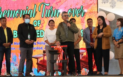 <p><strong>ARMCHAIRS FOR SCHOOLS.</strong> Agusan del Sur Gov. Santiago Cane Jr. (middle with microphone), together with DENR-13 Executive Director Nonito Tamayo (2nd right), leads the turnover of 7,667 armchairs to the Department of Education at the provincial capitol in Prosperidad town on Tuesday (Jan. 10, 2023). The armchairs were fabricated out of the 498 cubic meters of assorted logs and slabs donated by the DENR-13 to the provincial government last year. <em>(Photo grabbed from DENR-13 Facebook Page)</em></p>