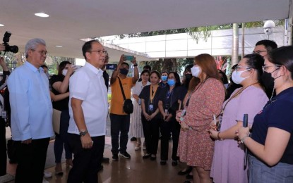 <p><strong>NEW CHIEF.</strong> Newly appointed Defense Secretary Carlito Galvez Jr. (in white polo barong) meets with officials and employees of the defense department in Camp Aguinaldo, Quezon City on Tuesday (Jan. 10, 2023). Galvez called on officials and employees to stay united in performing the agency's mandate. <em>(Photo courtesy of DND)</em></p>
