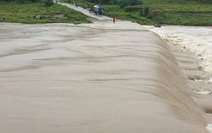 <p><strong>FLOODING</strong>. The spillway in Sitio Tabu-ay in Barangay Banban of Mabinay town, Negros Oriental province overflowed on Thursday (Jan. 12, 2023) due to the low-pressure area and the shear line that dumped heavy rains in the province. No casualties were reported even as Governor Roel Degamo ordered a province-wide suspension of classes at all levels in both public and private schools. <em>(Photo courtesy of the 11th Infantry Battalion, Philippine Army)</em></p>
