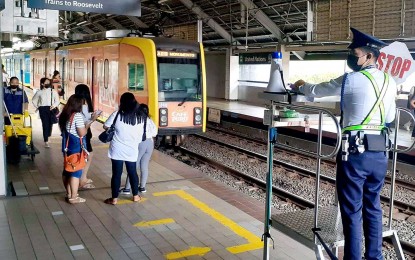 <p><strong>E-TICKETS.</strong> Passengers wait to board a Balintawak-bound train at the Light Rail Transit (LRT-1) United Nations Station on Jan. 12, 2023. Light Rail Manila Corporation (LRMC) and digital banking app Maya on Thursday (May 25, 2023) launched the LRT-1 QR Ticketing project for commuters to enjoy faster, safer, and more convenient digital transactions in public transportation. <em>(PNA photo by Ben Briones)</em></p>