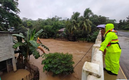<p><strong>FLOOD WATCH</strong>. Personnel of Sagay City Disaster Risk Reduction and Management Office monitor the water level in a major river on Jan. 11, 2023. On Friday (Jan. 13), at least 15,198 persons from 4,476 families have been affected by floods brought by heavy rains since Wednesday in Negros Occidental, data of the Provincial Social Welfare and Development Office showed. <em>(Photo courtesy of Sagay City Information and Tourism Office)</em></p>