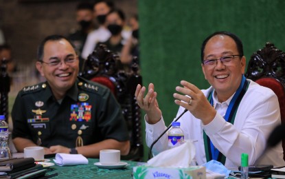 <p><strong>SECURITY CLUSTER.</strong> Defense Secretary Carlito Galvez Jr. (right) attends his first command conference at the AFP Commissioned Officers Club in Camp Aguinaldo, Quezon City on Thursday (Jan. 12, 2023). Seated beside him is Armed Forces of the Philippines chief-of-staff Gen. Andres Centino. <em>(Courtesy of Pinky Rose Fernandez/DND Comms)</em></p>
