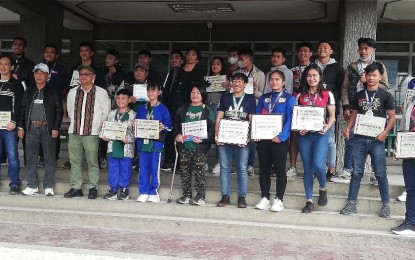 <p><strong>RECOGNITION.</strong> Benguet Governor Melchor Diclas (4th from left, front) join athletes in a photo opportunity during the athletes' recognition on Monday (Jan. 16, 2023) at the provincial capitol. Denesia Esnara (7th from left, front) was among those awarded after winning two bronze medals in the ASEAN Paralympics in August 2022. She said government support allows them to pursue their sports and contributes to their physical well-being. <em>(PNA photo by Liza T. Agoot)</em></p>