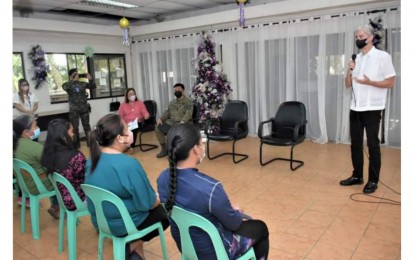 <p><strong>PEACE TALKS OFFER</strong>. Negros Occidental Governor Eugenio Jose Lacson (right) speaks to former New People's Army rebels, who received financial assistance from the government in December last year. Lacson renewed his call on Monday (Jan. 16, 2023) for those who remain in the armed struggle to surrender after a New People's Army here rejected the call for local peace talks. <em>(File photo courtesy of PIO Negros Occidental)</em></p>