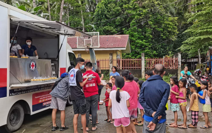 <p><strong>RELIEF.</strong> The Philippine Red Cross food truck distributes hot meals to evacuees at Gingoog City Comprehensive National High School in Misamis Oriental province in this undated photo. Various parts of Visayas and Mindanao have been affected by continuous rainfall and flooding caused by the shear line and low-pressure area.<em> (Courtesy of PRC Facebook)</em></p>