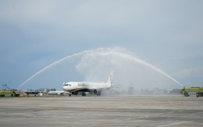 <p><strong>INAUGURAL FLIGHT</strong>. Firefighters are seen executing a water cannon salute to the 188-seater Airbus A321neo on its inaugural flight from Taoyuan International Airport in Taipei, Taiwan that arrived at the Mactan-Cebu International Airport on Tuesday (Jan. 17, 2023). The GMR Megawide Cebu Airport Corporation said Starlux Airlines commenced Tuesday its daily flights between Cebu and Taiwan. <em>(Photo courtesy of GMCAC)</em></p>