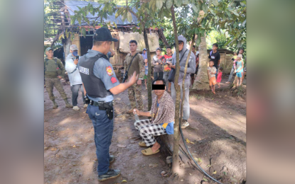 <p><strong>NABBED</strong>. Police and military forces in North Cotabato arrest suspected local terror group bomb expert Jordan Akmad, 40, (seated) in a safe house in President Roxas, North Cotabato on Tuesday (Jan. 17, 2023). The suspect has been linked to a series of bombing incidents in the province and the Soccsksargen region. <em>(Photo courtesy of 6ID)</em></p>