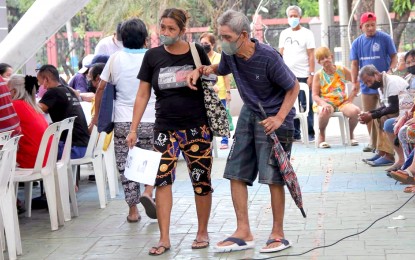 <p><strong>DOUBLE CHECK.</strong> The Quezon City government validates its list of indigent senior citizens entitled to assistance at SB Park in Batasan Hills on Jan. 17, 2023. The validation will be held until Jan. 27 in coordination with the Department of Social Welfare and Development, QC Social Services Development Department and Office for the Senior Citizens' Affairs.<em> (PNA photo by Robert Oswald P. Alfiler)</em></p>