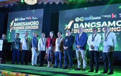 <p><strong>MAJOR PLAYER.</strong> Mindanao Development Authority (MinDA) Secretary Maria Belen Acosta (6th from right) poses with Bangsamoro Autonomous Region in Muslim Mindanao (BARMM) officials during the opening of the three-day 1st Bangsamoro Business Congress held in Cotabato City on Tuesday (Jan. 17, 2023). The BARMM is being eyed as the next key economic player in the Brunei Darussalam-Indonesia- Malaysia-Philippines East ASEAN Growth Area (BIMP-EAGA) sub-region. <em>(Photo courtesy of MinDA)</em></p>
