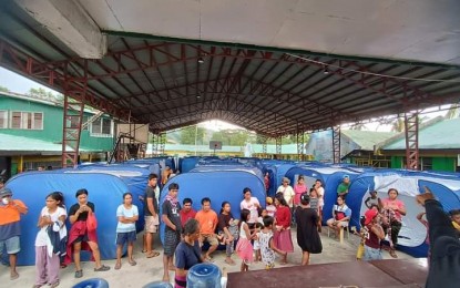 <p><strong>EVACUEES</strong>. Residents of Purok Malipayon, Barangay San Jose in Sipalay City, Negros Occidental seek shelter at an evacuation site inside Binulig Elementary School after they were displaced following an encounter between the Philippine Army's 15th Infantry Battalion troops and New People's Army rebels on Wednesday afternoon. On Thursday (Jan. 19, 2023), some 210 individuals from 53 families have been evacuated, based on the report of the City Social Welfare and Development Office. <em>(Photo courtesy of Sipalay City-LGU)</em></p>