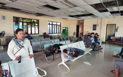 <p><strong>STRANDED</strong>. Almost a hundred passengers and 10 small boats bound for Quezon province's northern towns are stranded at the port in Real town on Friday (Jan. 20, 2023). The Philippine Coast Guard has suspended sea travel since Jan. 17 after the weather bureau issued a gale warning. <em>(Photo courtesy of Kevin Boiser/Real LGU)</em></p>