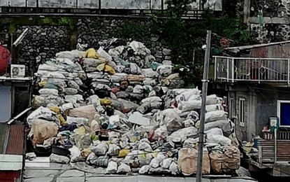 <p><strong>GARBAGE COLLECTION</strong>. A pile of garbage at a vacant space in Barangay Irisan in Baguio City before they are collected in this undated photo. The Baguio City government is looking at privatizing its garbage management system to save money. <em>(PNA file photo by Liza T. Agoot)</em></p>