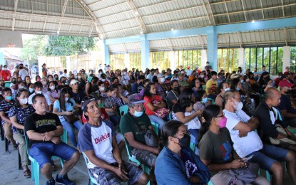 <p><strong>ASSISTANCE</strong>. Hog-raisers affected by the African swine fever in Oton, Iloilo receive a total of PHP1.64 million in financial aid from the provincial government and 400 packs of vegetable seeds from the Department of Agriculture on Thursday (Jan. 19, 2023). The provincial government will work with the department to look into the possibility of starting the repopulation in Oton where swine affected by ASF have been depopulated. <em>(Photo courtesy of DA Regional Agri-Fishery Information Section FB)</em></p>