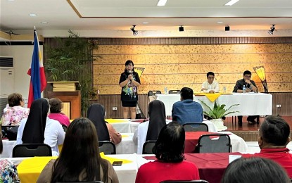 <p><strong>STUDENT EMPLOYMENT</strong>. Participants in the pledging session for partner LGUs and establishments joining the Special Program of the Employment of Students (SPES) listen as DOLE-7 OIC Director Lilia A. Estillore (standing with microphone) speaks about the terms of reference of the activity. Estillore on Friday (Jan. 20, 2023) said about 6,000 students in Cebu will participate in the SPES, which will be funded with PHP45.5 million in pledges from participating LGUs and shops. <em>(Photo courtesy of DOLE-7)</em></p>