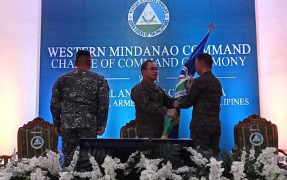 <p><strong>NEW COMMANDER.</strong> The Armed Forces of the Philippines (AFP) installs Maj. Gen. Roy Galido (right, back to the camera) as the new commander of the Western Mindanao, replacing Maj. Gen. Arturo Rojas (left, back to the camera) on Friday (Jan. 20, 2023). Gen. Andres Centino, AFP chief of staff (center) presides the change of command at Camp Don Basilio Navarro that houses the headquarters of Westmincom in Calarian, Zamboanga City.<em> (PNA photo by Teofilo P. Garcia Jr.)</em></p>