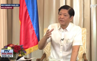 <p><strong>MEDIA INTERVIEW</strong>. President Ferdinand R. Marcos Jr. answers questions during an interview with select reporters at Malacaña Palace on Monday (Jan. 23, 2023). Marcos said he will lessen his foreign travels this year to follow up on agreements signed during his previous trips. <em>(Screengrab from RTVM)</em></p>