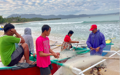 <p><strong>‘GOOD DECISION’</strong>. Fisherfolk in Ilocos Norte prepare to head out to sea in this undated photo. Much to the delight of local fishers in Ilocos Norte, a live fire exercise at sea was initially planned in the province but it was moved to Zambales instead. <em>(File photo by Leilanie Adriano)</em></p>