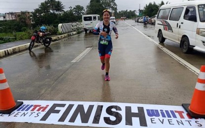 <p><strong>WINNER</strong>. Private Genesis Maraña of the Philippine Army bags the overall women’s title in the 8th Mt. Banahaw De Lucban Duathlon in Lucban, Quezon on Jan. 22, 2023. The Army captured home seven medals, including three golds<em>. (Photo courtesy of Philippine Army)</em></p>