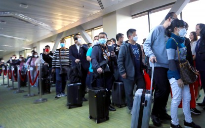 <p><strong>TOURISM GROWTH.</strong> Tourists from China arrive at Ninoy Aquino International Airport Terminal 1 in Pasay City on Jan. 24, 2023. Rizal Commercial Banking Corporation chief economist Michael Ricafort said on Friday (June 16, 2023) that the share of tourism to the country's gross domestic product could reach as high as eight percent this year due to the further reopening of the Philippine economy <em>(PNA photo by Joey O. Razon)</em></p>