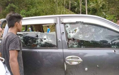 <p><strong>AMBUSH.</strong> A bystander looks at the bullet-riddled vehicle of Ali Manangca, who was killed along with four others in an ambush Thursday (Jan. 26, 2023)  in Barangay Piña, Sirawai, Zamboanga del Norte. Manangca is the village chief of Balubuan, Sirawai. <em>(Photo courtesy of Ely Dumaboc)</em></p>