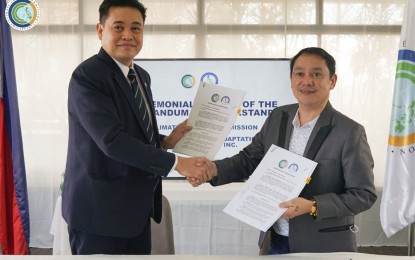 <p><strong>CLIMATE RESILIENCE.</strong> Climate Change Commission (CCC) Vice Chairperson and Executive Director Robert Borje and Local Climate Change Adaptation for Development, Inc. (LCCAD) Executive Director Manuel “Nong” Rangas sign a memorandum of understanding (MOU) in this undated photo. The MOU aims to enhance the capacity of local government units in formulating and updating Local Climate Change Action Plans. <em>(Photo courtesy of CCC)</em></p>