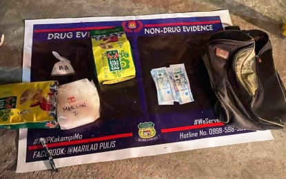 <p><strong>BUSTED.</strong> Authorities seize illegal drugs worth nearly PHP14 million and other pieces of evidence from a suspect arrested in a buy-bust in Marilao, Bulacan on Wednesday night (Jan. 25, 2023). The suspect was identified as Marlon Navarro, 44, of Novaliches, Caloocan City.<em> (Photo courtesy of the Bulacan Police Provincial Office)</em></p>