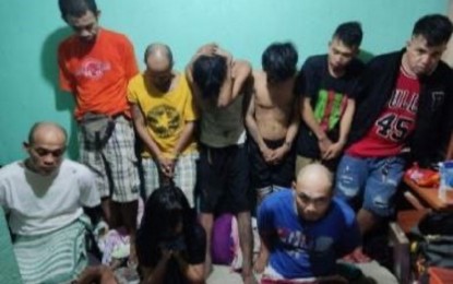 <p><strong>DRUG BUST</strong>. Police operatives apprehend 32 drug suspects and seize 19 sachets of suspected shabu with an estimated street value of PHP918,000 after a buy-bust operation in a drug den in Barangay Bakhaw in Iloilo City’s Mandurriao on Wednesday evening (Jan. 25, 2023). Regional police director, Brig. Gen. Leo M. Francisco, said on Thursday afternoon (Jan. 26, 2023) it took the operatives two weeks to be able to penetrate the drug den in a squatter's area. <em>(Photo courtesy of RPDEU 6)</em></p>