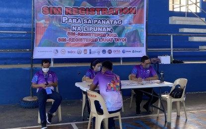 <p><strong>SIM REGISTRATION</strong>. Ilocos Norte residents register their SIM cards during the pilot rollout of the SIM registration at the Pasuquin Gymnasium on Wednesday (Jan. 25, 2023). Assisted SIM card registration is being pilot tested in 15 locations nationwide until Jan. 27, 2023. <em>(PIA Ilocos Norte photo)</em></p>