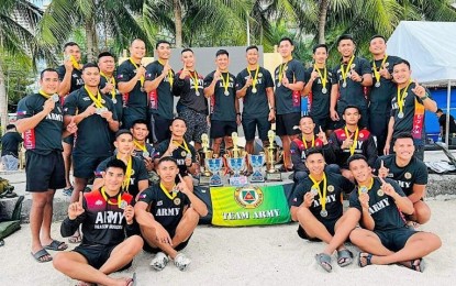 <p><strong>CHAMPION.</strong> A group photo of the Philippine Army Dragon Warriors who dominated the 4th leg of the Philippine Dragon Boat Federation (PDBF) Regatta in Dolomite Beach, Manila Baywalk on Jan. 29, 2023. The Dragon Warriors have been a powerhouse team since it debuted in the local dragon boat in 2010. <em>(Photo courtesy of the Philippine Army)</em></p>