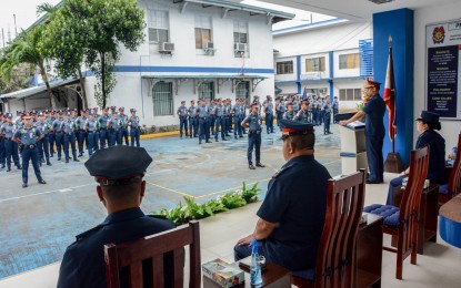 <p><strong>ORDER.</strong> Col. Joeresty P. Coronica, newly-designated officer-in-charge of the Iloilo City Police Office, talks to the men and women of the station during their flag raising ceremony on Monday (Jan. 30, 2023). Iloilo City Mayor Jerry Treñas, in a press conference said he wanted the new OIC to ensure the continuous anti-drug campaign and implement police visibility. <em>(Photo courtesy of ICPO Pulis Serbisyo Publiko FB page) </em></p>