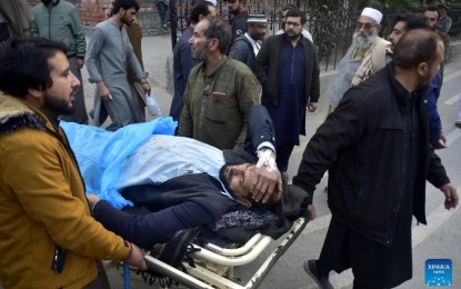 <p><strong>DEADLY BLAST</strong>. People transfer an injured man to a hospital following a blast at a mosque in northwest Pakistan's Peshawar on Jan. 30, 2023. The death toll from a suicide bomb blast raised to 88. <em>(Photo by Saeed Ahmad/Xinhua)</em></p>