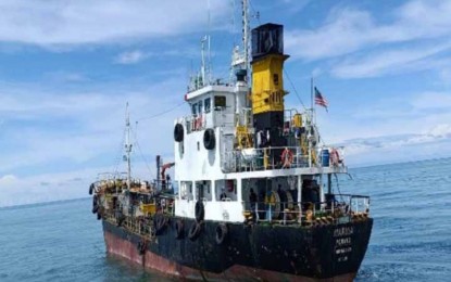 <p><strong>FUEL SMUGGLING.</strong> Authorities impound two vessels, one of which is a Malaysian-owned (in photo), loaded with 400,000 liters of diesel with an estimated worth of P29.6 million in Lihiman Island, Turtle Islands town, Tawi-Tawi province, on Saturday (Jan. 28, 2023). Brig. Gen. Romeo Racadio, Joint Task Force (JTF)-Tawi-Tawi, commander, bared Tuesday (Jan. 31) that the vessels were apprehended illegally loading diesel on the island. <em>(Photo courtesy of JTF-Tawi-Tawi)</em></p>