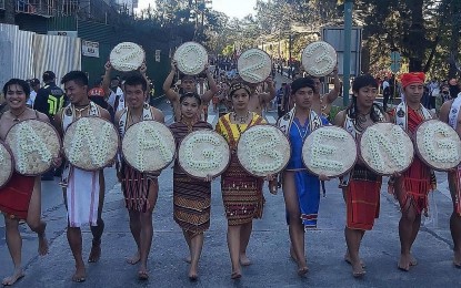 <p><strong>COMMUNITY SPIRIT</strong>. Participants take part in Baguio City's month-long "Panagbenga 2023," which opened on Wednesday (Feb. 1, 2023). The festival was originally conceptualized to help lift the city’s economy after the 1990 earthquake. <em>(PNA photo by Liza T. Agoot)</em></p>