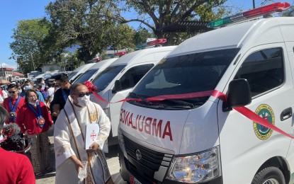 <p><strong>HEALTHCARE BOOST</strong>. Rev. Father Engelbert Elarmo blesses five units of fully-equipped ambulances in Laoag City on Wednesday (Feb. 1, 2023). These are meant for the Gov. Roque B. Ablan Sr. Memorial Hospital as well as the district hospitals in the towns of Bangui, Vintar, Sarrat and Piddig –all in the first district of Ilocos Norte province.<em> (Photo by Leilanie Adriano)</em></p>