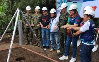 <p><strong>GROUNDBREAKING</strong>. Lt. Gen. Benedict Arevalo (5th from left) leads the groundbreaking of the multi-million pesos hanging bridge in Barangay Abis, Mabinay town in Negros Oriental province on Wednesday (Feb. 1, 2023). The old bridge was washed out during the onslaught of Typhoon Odette (Rai) on Dec. 16, 2021. <em>(PNA photo by Judy Flores Partlow)</em></p>