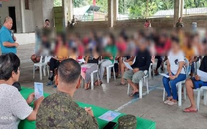 <p><strong>PERSONA NON GRATA.</strong> Residents of Barangay Tagbongabong of Remedios T. Romualdez town in Agusan del Norte province gather in an assembly on Tuesday (Jan. 31, 2023) to declare the communist New People’s Army as persona non grata. The activity was joined by the top local officials of the town and the officers of the Army’s 65th Infantry Battalion. <em>(Photo courtesy of 65IB)</em></p>