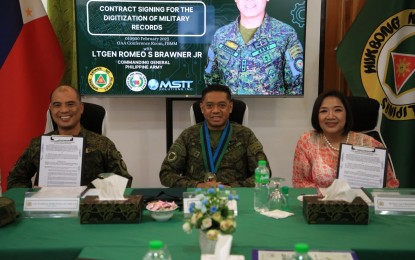 <p><strong>RECORDS DIGITIZATION.</strong> Philippine Army commander Lt. Gen. Romeo S. Brawne Jr. (center), Army Adjutant Col. Danilo E. Estrañero (left), and Master’s Stewards Information Technology (MIST) Solutions, Inc. managing director Mary Ann Cabal-Soleno (right) formalize the agreement for the digitization of military records during the signing ceremony in Fort Bonifacio on Wednesday (Feb. 1, 2023). The digitization project is part of the PA leadership’s efforts to leverage technology in providing relevant and responsive services to soldiers.<em> (Photo courtesy of the Philippine Army)</em></p>