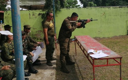 <p><strong>MARKSMANSHIP TRAINING</strong>. Photo shows Army reservist, Staff Sgt. Adonis Quitoy, head of the security office of a giant mall in Cebu City, assisting a fellow volunteer during the "Tansan Challenge" marksmanship training at the Visayas Command firing range in Camp Lapu-Lapu on Feb. 5, 2023. Brig. Gen. Erik Miguel Espina on Tuesday (Feb. 7) said the marksmanship is included in the monthly skills training of the 1901st Reader Reserve Infantry Brigade.<em> (Photo courtesy of 1901st Public Affairs Team)</em></p>