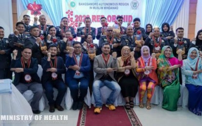 <p><strong>RECOGNIZED.</strong> Officials of jails and hospitals in the Bangsamoro Autonomous Region in Muslim Mindanao (BARMM), including Ministry of Health (MOH) officials, pose after receiving the Red Orchid Awards 2022 for their successful no-smoking program implementation in their respective workplaces. At least 11 regional offices and health facilities in the region received the coveted award for 2022. <em>(Photo from MOH-BARMM)</em></p>