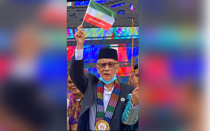 <p><strong>THE GUARDIAN.</strong> Sheik Khalifa Nando, the BARMM 'Wali' (waving Bangsamoro flaglet) was last seen in public on Jan. 25 during the opening ceremonies of the BARMM 4th founding anniversary in Cotabato City. He died on Sunday (Feb. 5, 2023) at age 82.<em> (Photo courtesy of Bangsamoro Information Office - BARMM)</em></p>