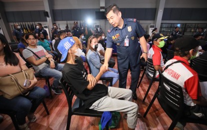 <p><strong>ACCOMPLISHMENT.</strong> National Capital Region Police Office (NCRPO) deputy director, Brig. Gen. Jack Wanky, greets the relatives of victims of various crime incidents who shared testimonies and how the police were able to assist them during the press briefing at the NCRPO headquarters in Camp Bagong Diwa, Taguig City on Monday (Feb. 6, 2023). The NCRPO said police officers in Metro Manila have seized over PHP10.7 million worth of illegal drugs from Jan. 23 to 29. <em>(PNA photo by Avito Dalan)</em></p>