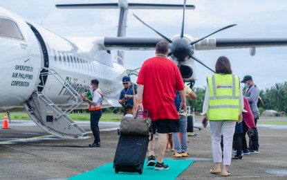 <p><strong>AIR ROUTE</strong>. Passengers boarding an aircraft at the Borongan City Airport in Eastern Samar province in this undated photo. The city government of Borongan in Eastern Samar will provide air fare discounts to encourage more passengers to take the air route connecting the city to Cebu and Manila. <em>(Photo courtesy of Borongan city information office)</em></p>