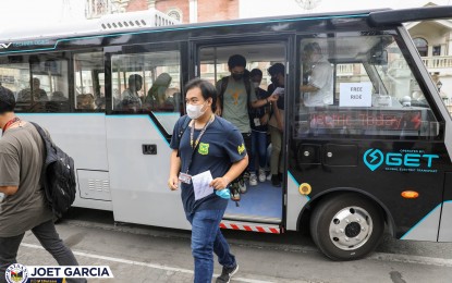 <p><strong>ELECTRIC VEHICLE</strong>. Students avail of free rides on board an electric shuttle being test-run in Balanga City, Bataan on Tuesday (Feb. 7, 2023). In partnership with the Global Electric Transport City Optimized Managed Electric Transport (GET COMET), the provincial government of Bataan is conducting a three-day test-run of the electric vehicles within the city. <em>(Photo courtesy of the Provincial Government of Bataan)</em></p>